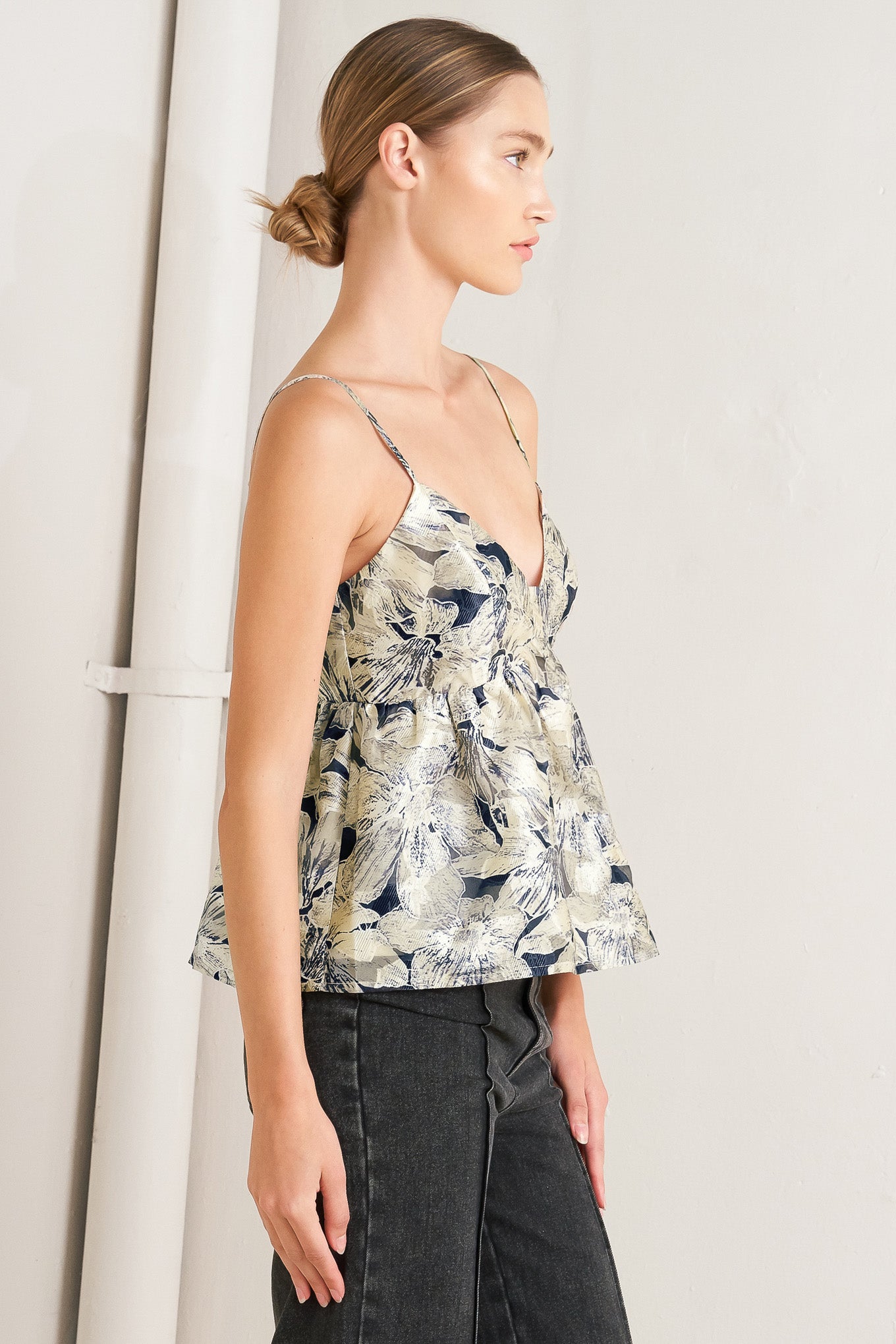 A woven textured top with back zipper closure