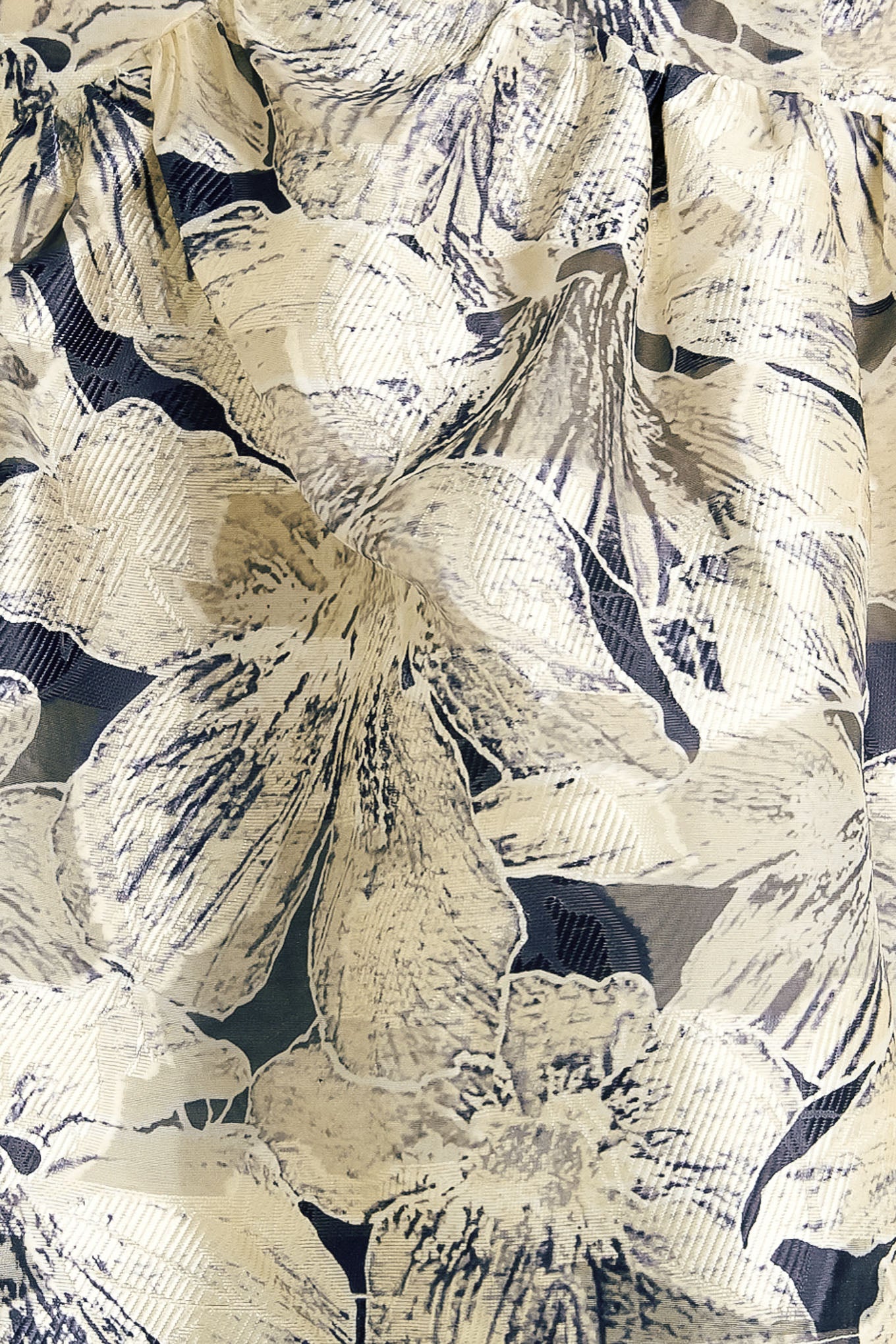 A woven textured top with back zipper closure