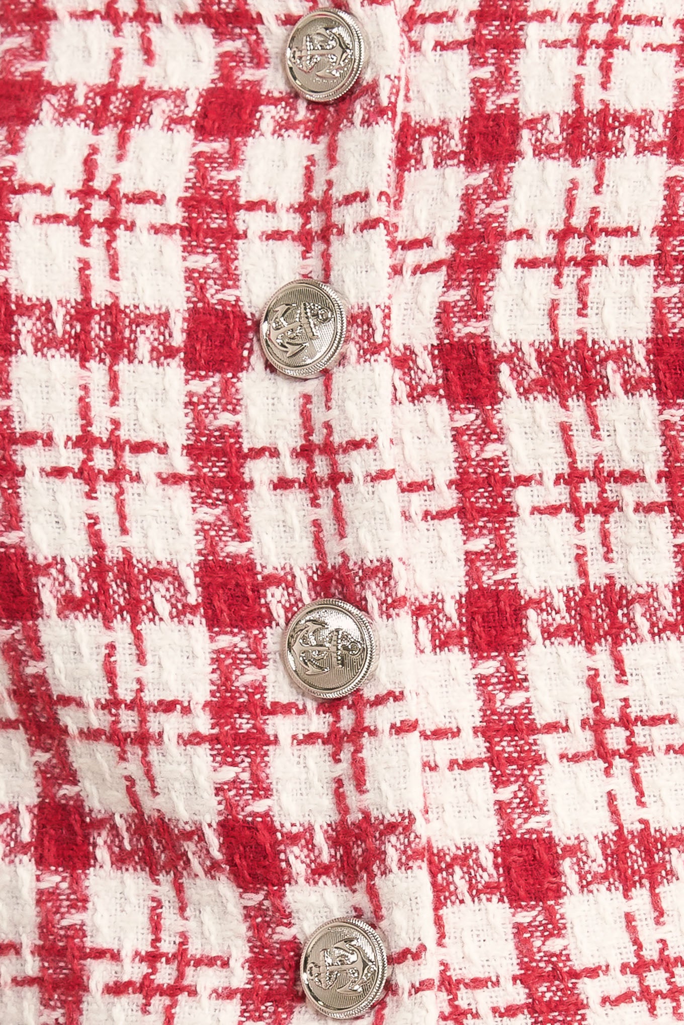 A tweed top featuring strapless, button down detail, faux pockets and back zipper closure