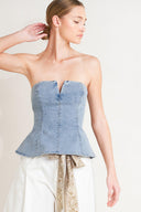 
A washed denim top featuring strapless, V cut out, peplum and back zipper closure

Details:

Self : 85% Cotton 14% Polyester 1% Spandex&nbsp;
Lining : 90% Polyester 10% Cotton

Size &amp; Fit

- Model is 5`8" And Wearing Size Small
- Measurements Taken From Size Small
- Approx. Length: 14"