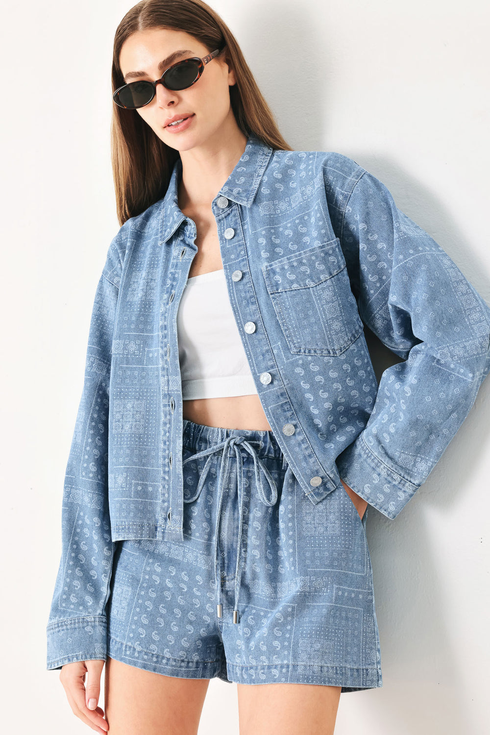 Woman wearing blue bandana-patterned shorts with elastic waist, tie and side pockets | FREEMARKET | Flying Tomato