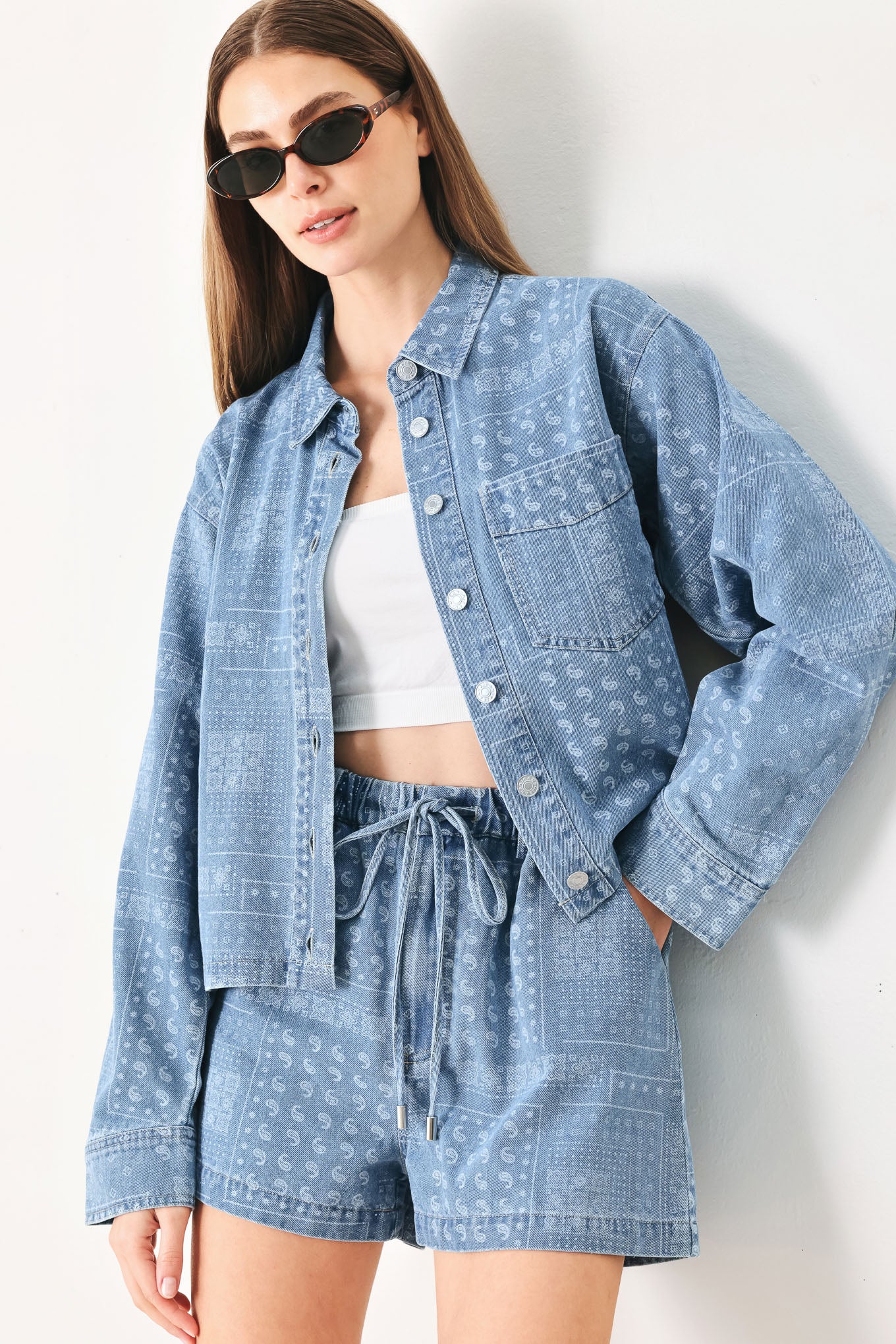 Woman wearing a blue bandana patterned denim jacket with front closure | FREEMARKET | Flying Tomato