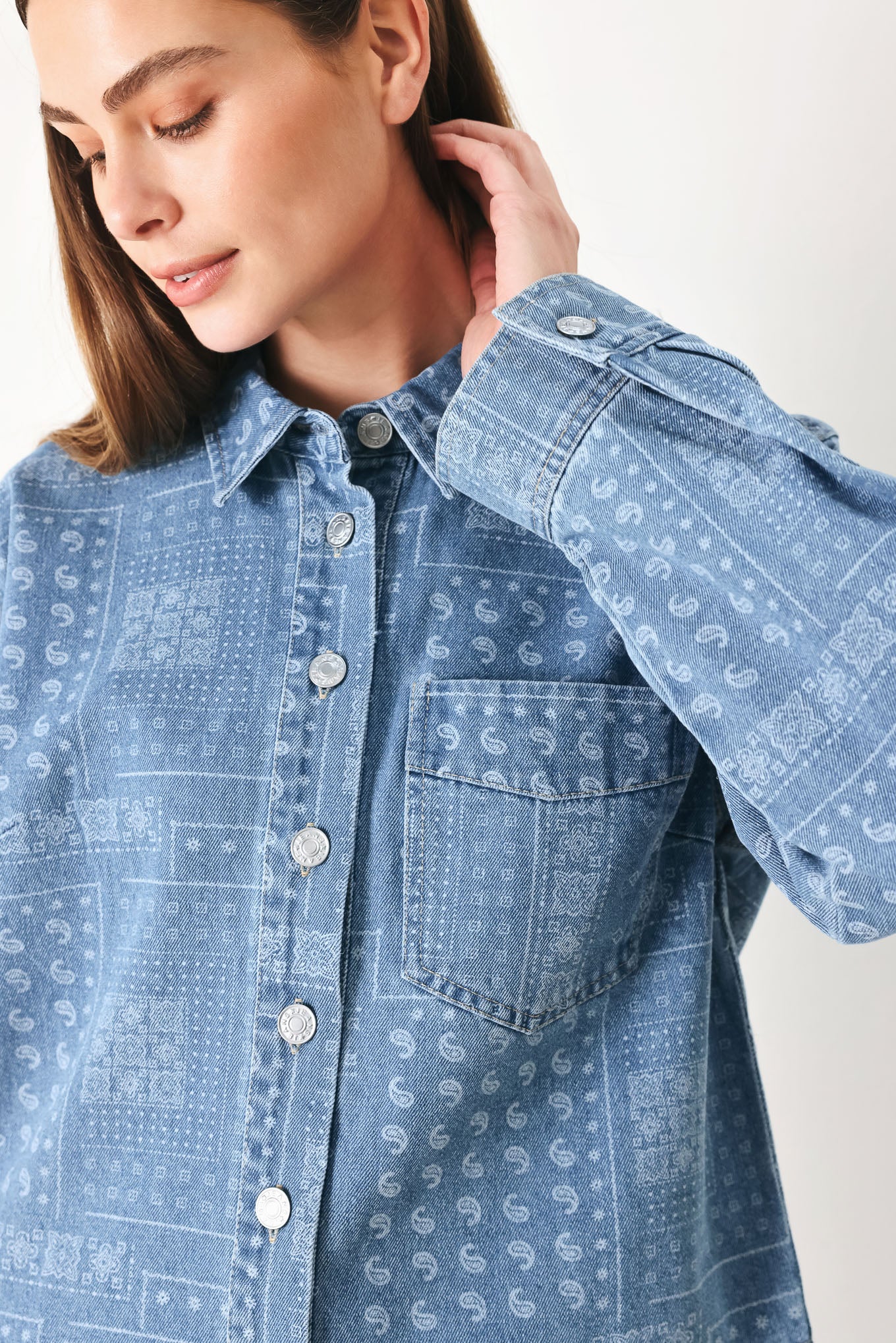Woman wearing a blue bandana patterned denim jacket with front closure | FREEMARKET | Flying Tomato