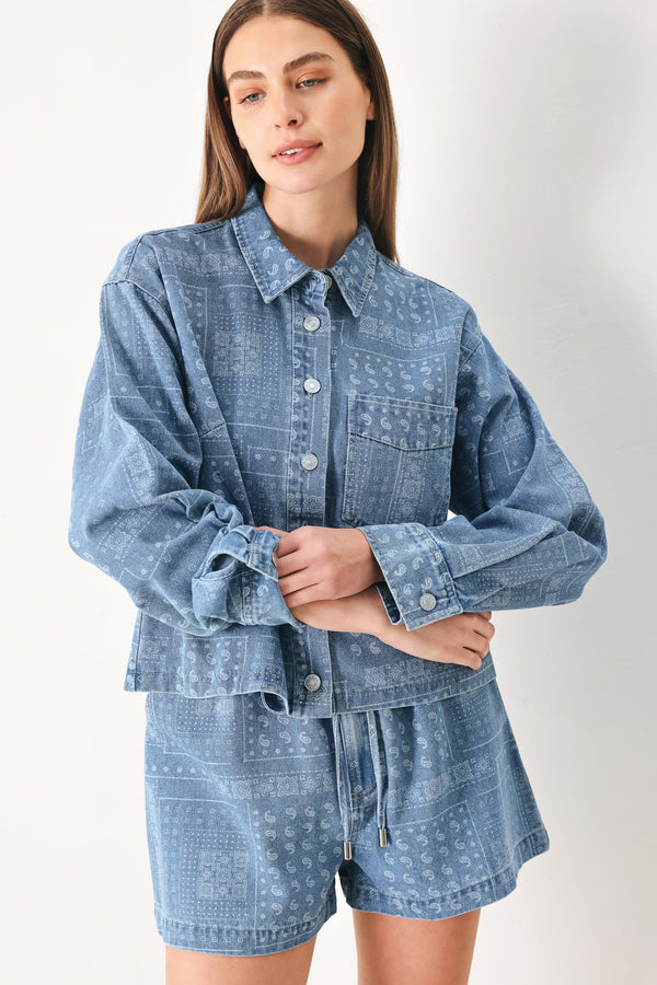 Woman wearing a blue bandana patterned denim jacket with front closure | FREEMARKET | Flying Tomato