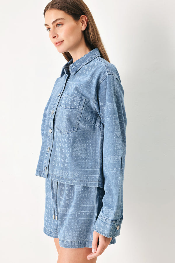 Woman wearing a blue bandana patterned denim jacket with front closure | FREEMARKET | Flying Tomato