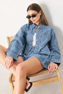 Woman wearing a blue bandana patterned denim jacket with front closure | FREEMARKET | Flying Tomato