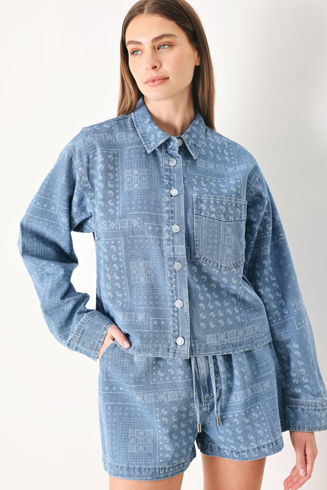 Woman wearing a blue bandana patterned denim jacket with front closure | FREEMARKET | Flying Tomato