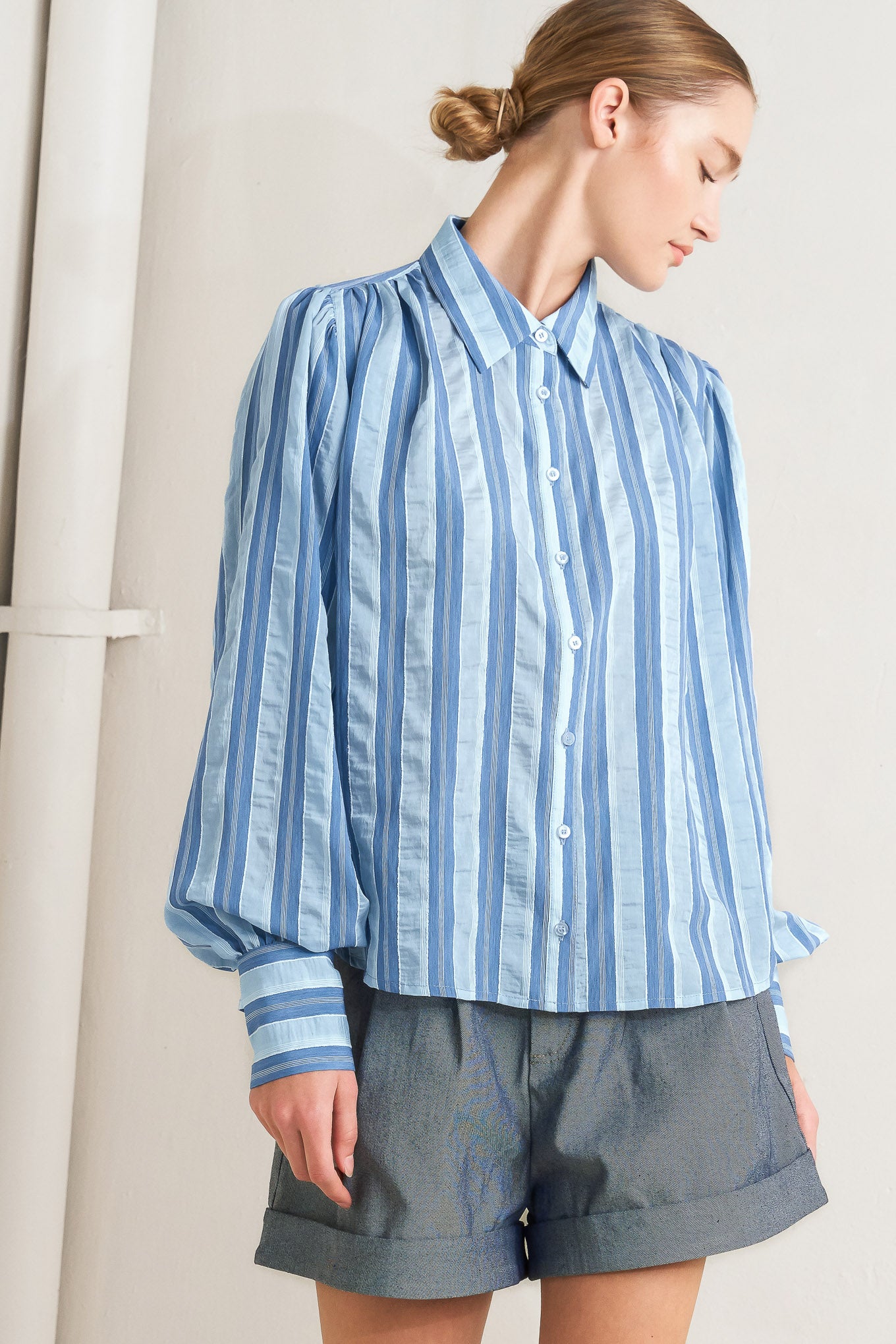 Blue striped long-sleeve button-front blouse

Details:

Self: 40% Tencel 38% Polyester 20% Nylon 2% Lurex

Size & Fit

- Model is 5`8" And Wearing Size Small
- Measurements Taken From Size Small
- Approx. Length: 27"