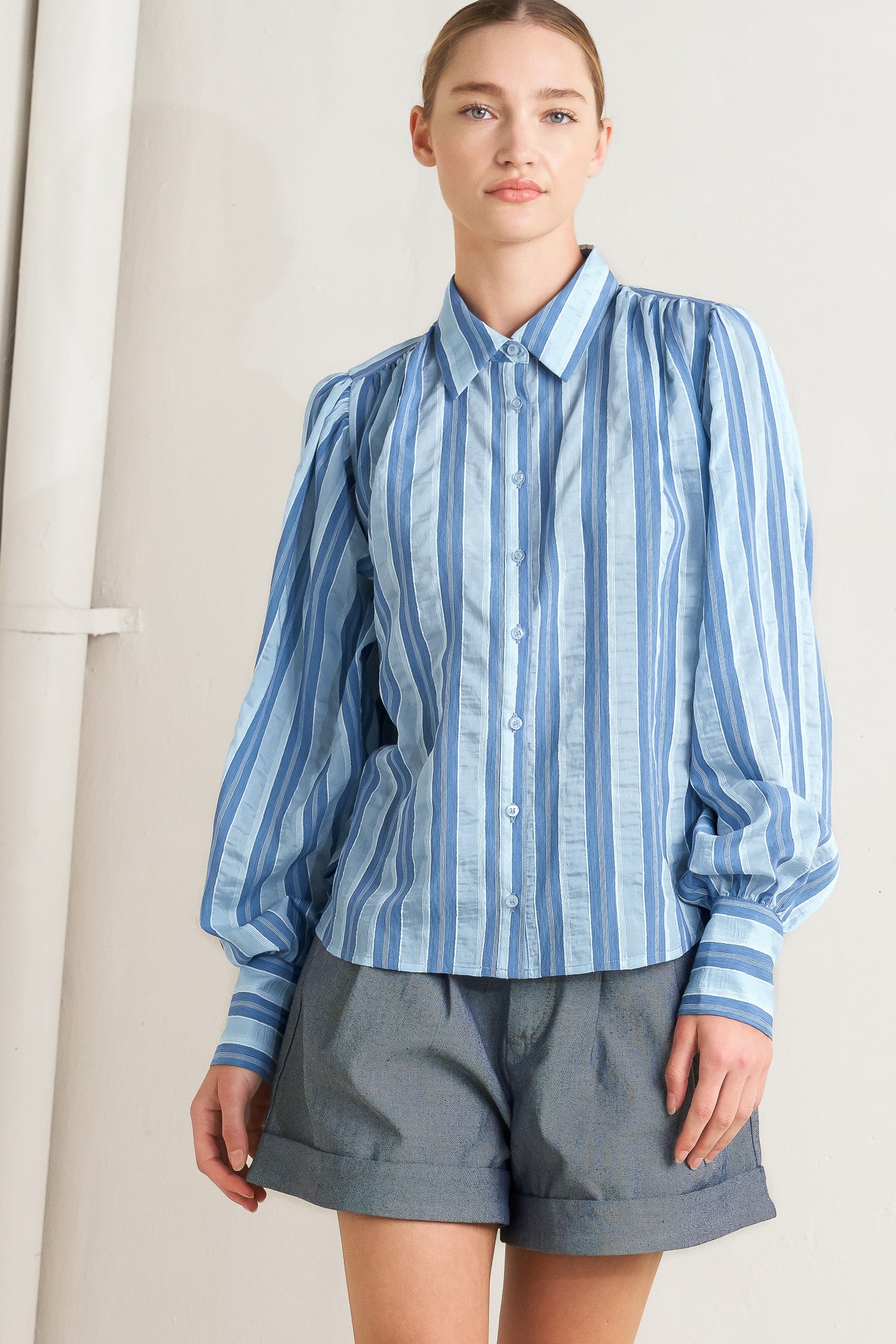Blue striped long-sleeve button-front blouse

Details:

Self: 40% Tencel 38% Polyester 20% Nylon 2% Lurex

Size & Fit

- Model is 5`8" And Wearing Size Small
- Measurements Taken From Size Small
- Approx. Length: 27"