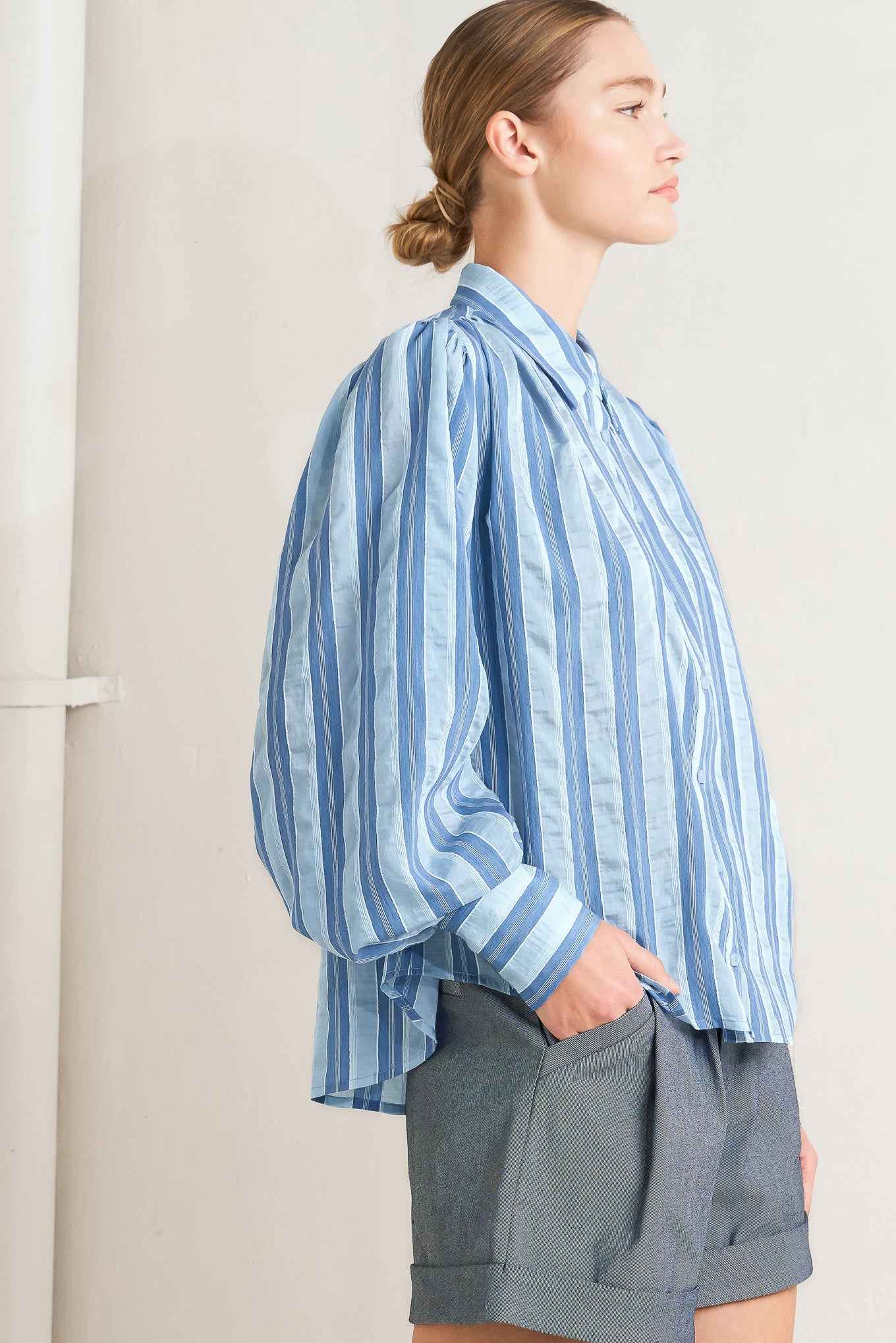 Blue striped long-sleeve button-front blouse

Details:

Self: 40% Tencel 38% Polyester 20% Nylon 2% Lurex

Size & Fit

- Model is 5`8" And Wearing Size Small
- Measurements Taken From Size Small
- Approx. Length: 27"
