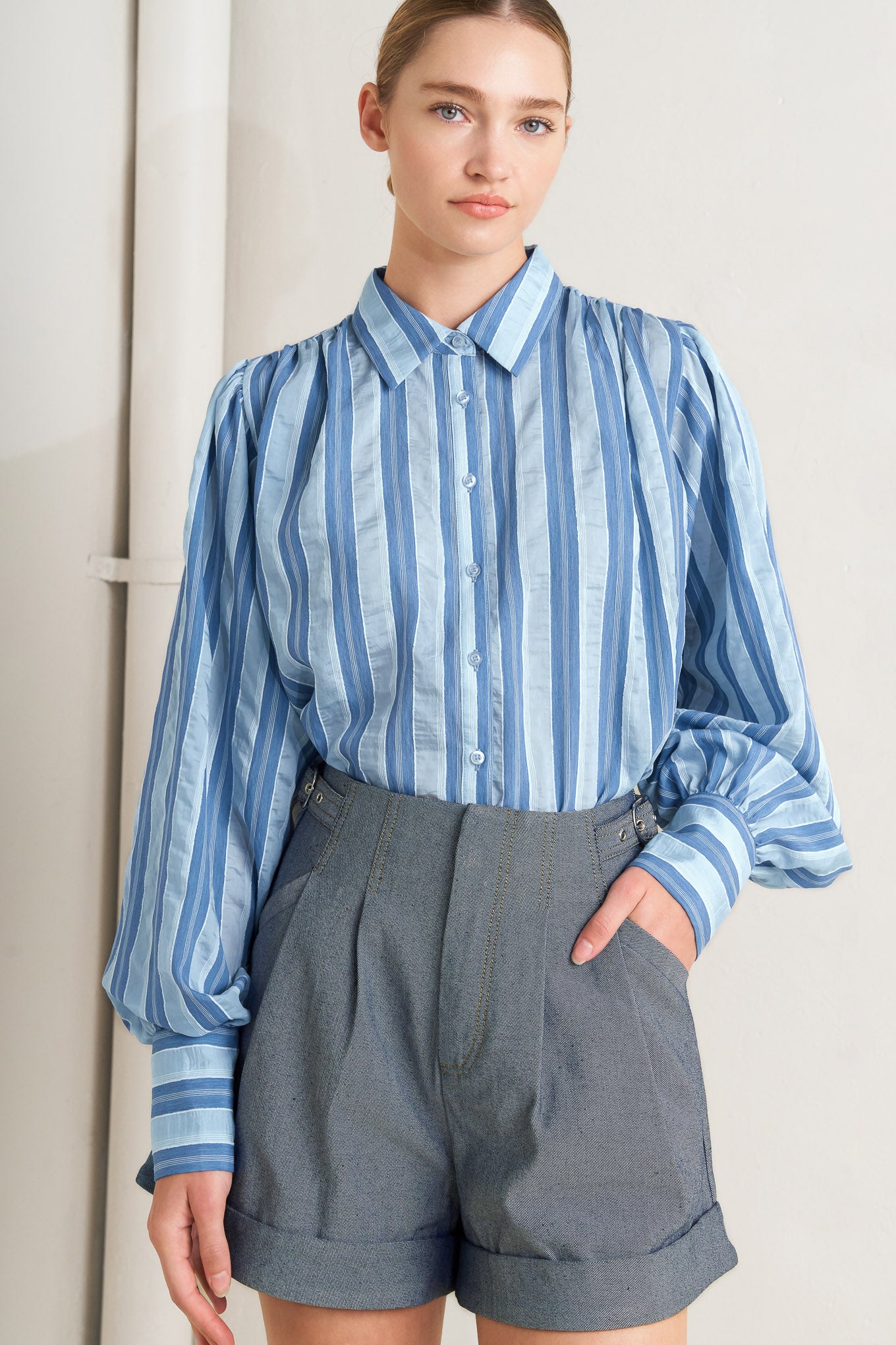 Blue striped long-sleeve button-front blouse

Details:

Self: 40% Tencel 38% Polyester 20% Nylon 2% Lurex

Size & Fit

- Model is 5`8" And Wearing Size Small
- Measurements Taken From Size Small
- Approx. Length: 27"