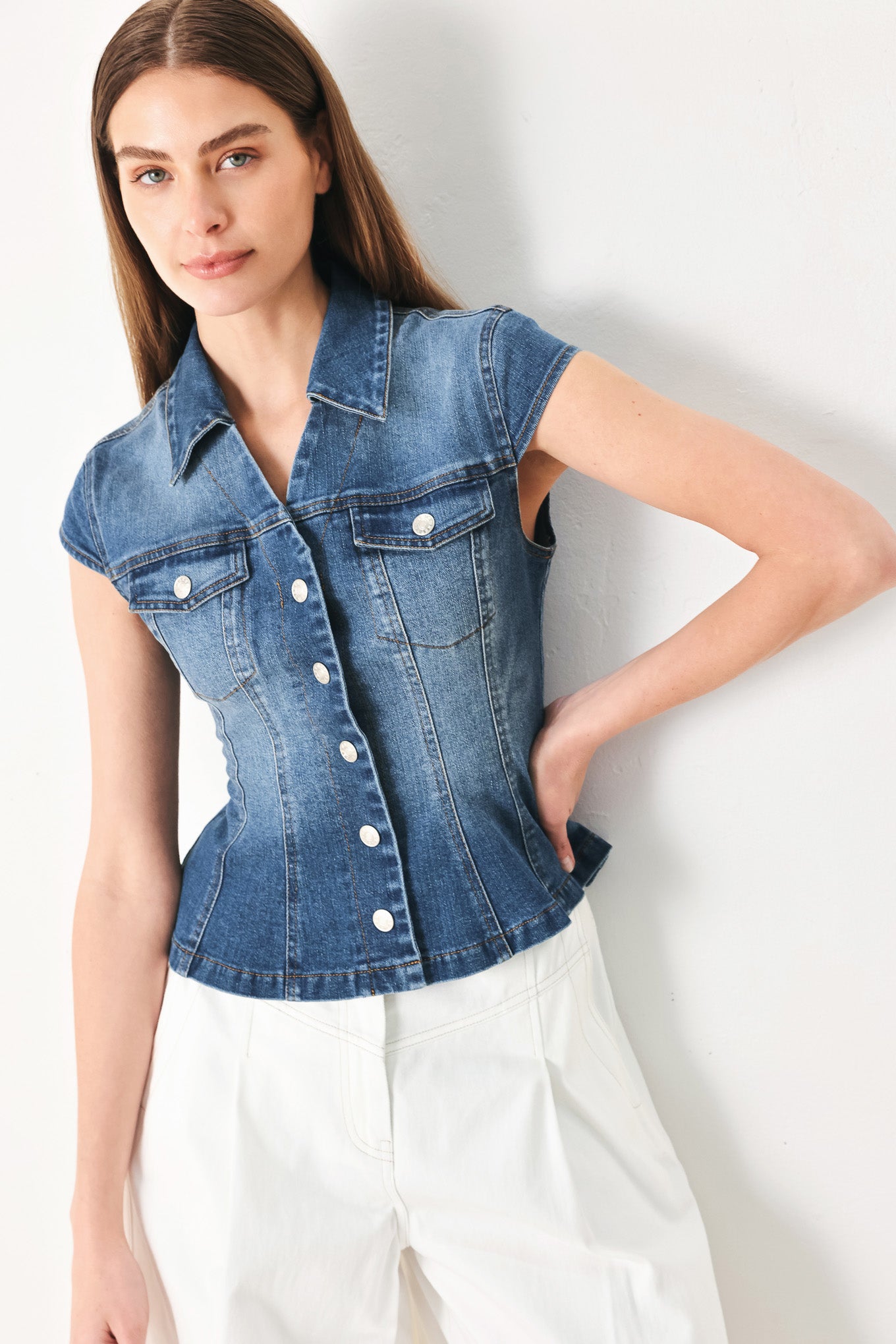 Woman wearing a denim top with collar, cap sleeve and front button down | FREEMARKET | Flying Tomato