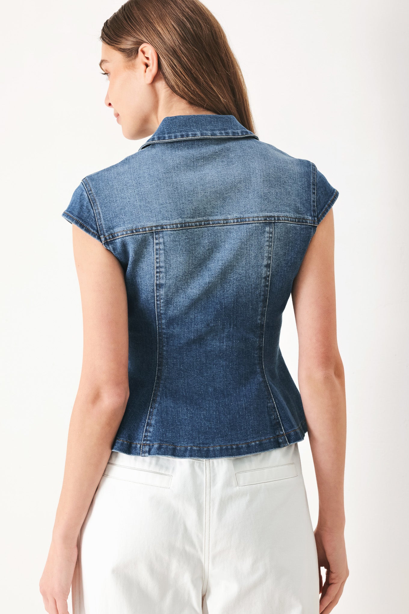 Woman wearing a denim top with collar, cap sleeve and front button down | FREEMARKET | Flying Tomato