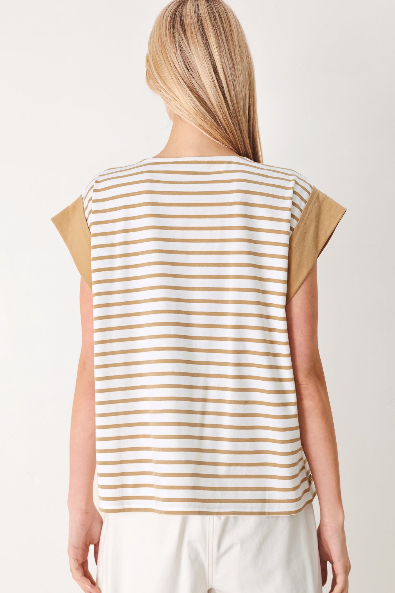 Woman wearing a striped knit top with wide neckline, short sleeve and side button | FREEMARKET