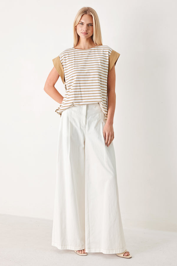 Woman wearing a striped knit top with wide neckline, short sleeve and side button | FREEMARKET