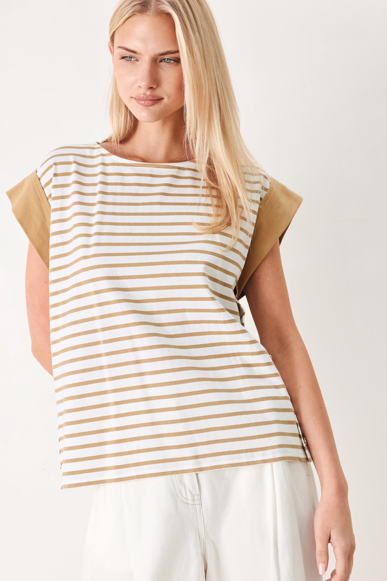 Woman wearing a striped knit top with wide neckline, short sleeve and side button | FREEMARKET
