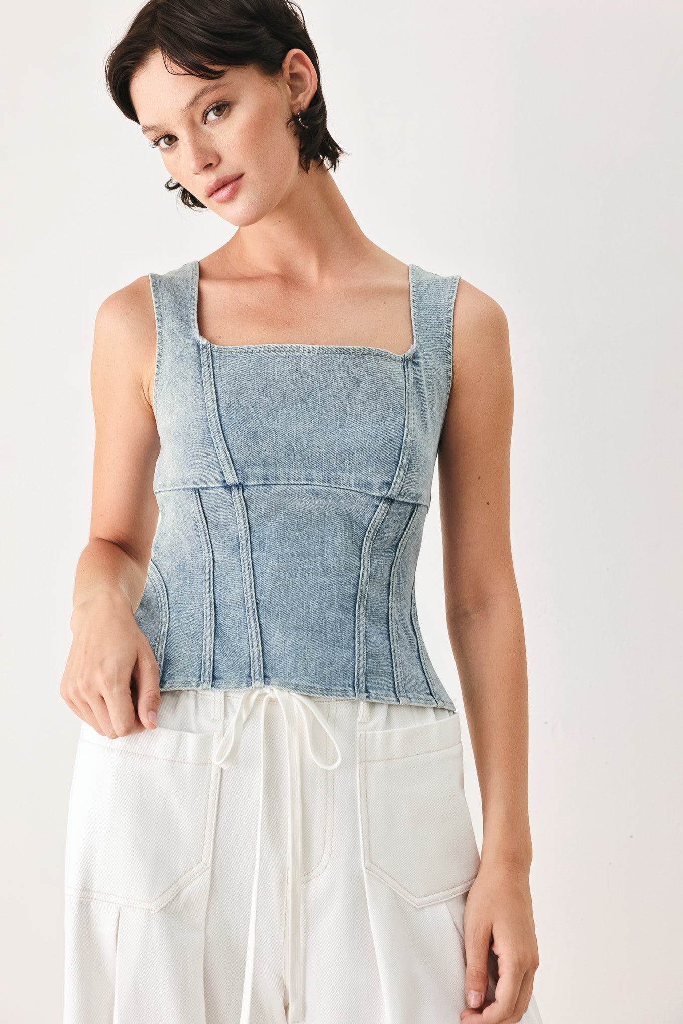 Woman wearing a denim corset denim top with square neckline and back zipper closure | FREEMARKET