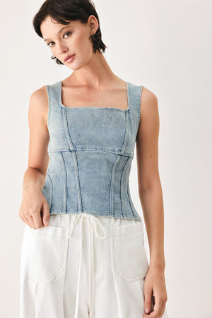 Woman wearing a denim corset denim top with square neckline and back zipper closure | FREEMARKET