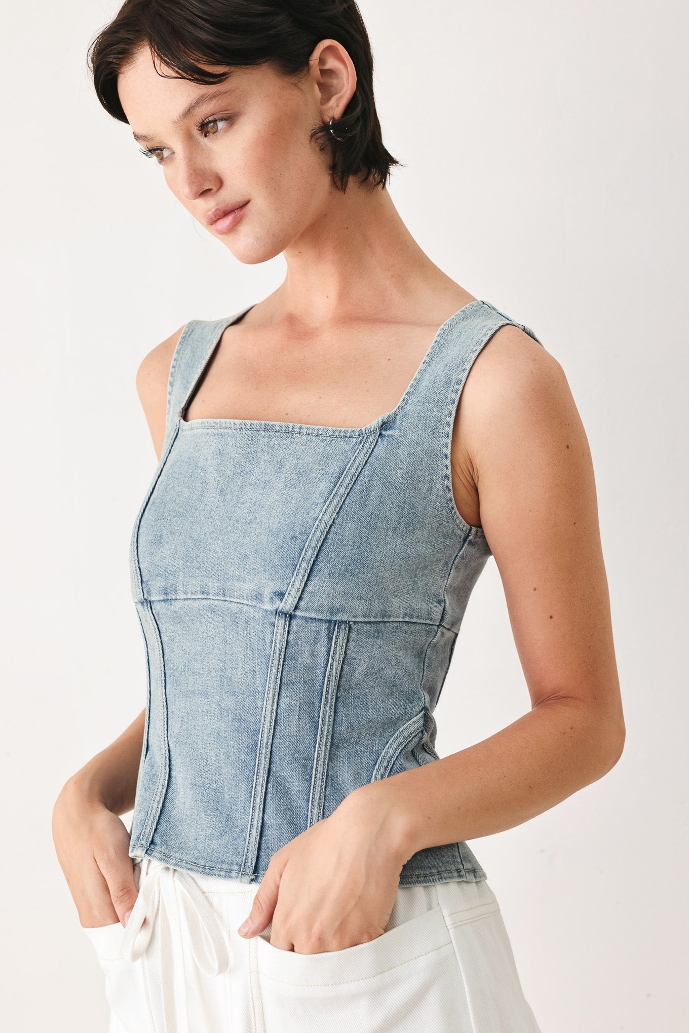 Woman wearing a denim corset denim top with square neckline and back zipper closure | FREEMARKET
