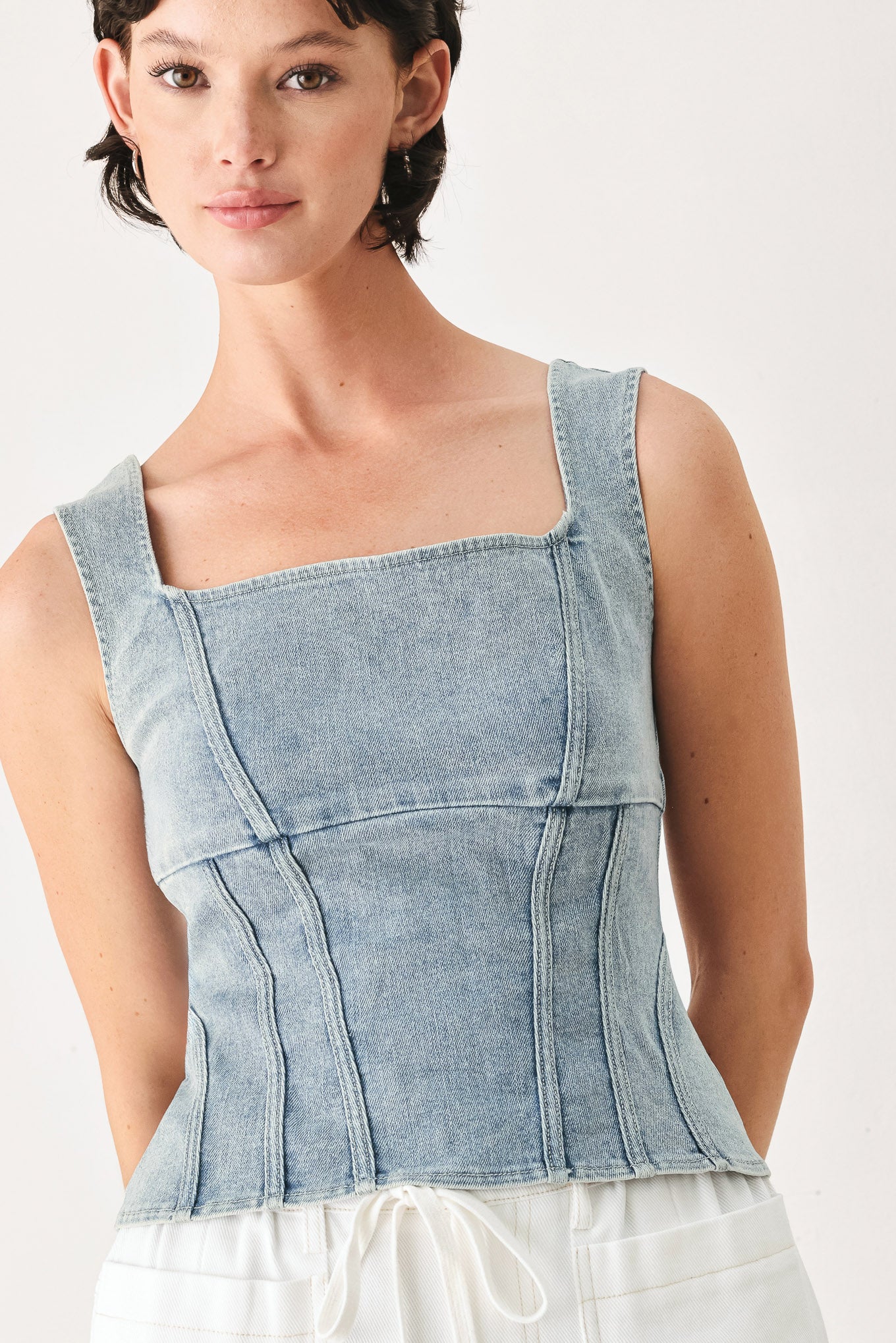 Woman wearing a denim corset denim top with square neckline and back zipper closure | FREEMARKET