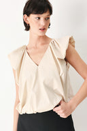 Woman wearing n ivory blouse top with V neckline and bubble sleeve and waist  | FREEMARKET