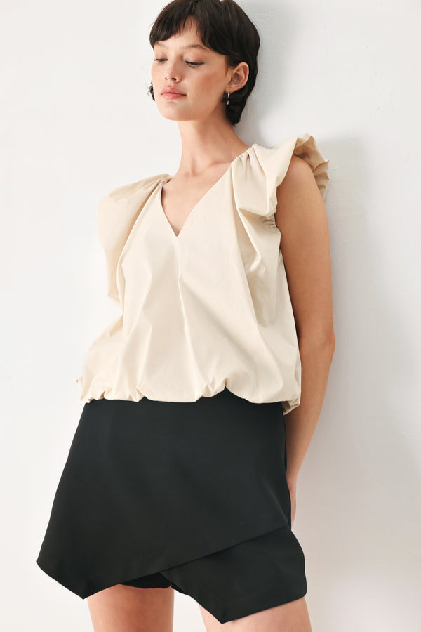 Woman wearing n ivory blouse top with V neckline and bubble sleeve and waist  | FREEMARKET