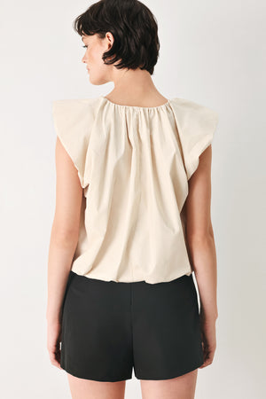 Woman wearing n ivory blouse top with V neckline and bubble sleeve and waist  | FREEMARKET