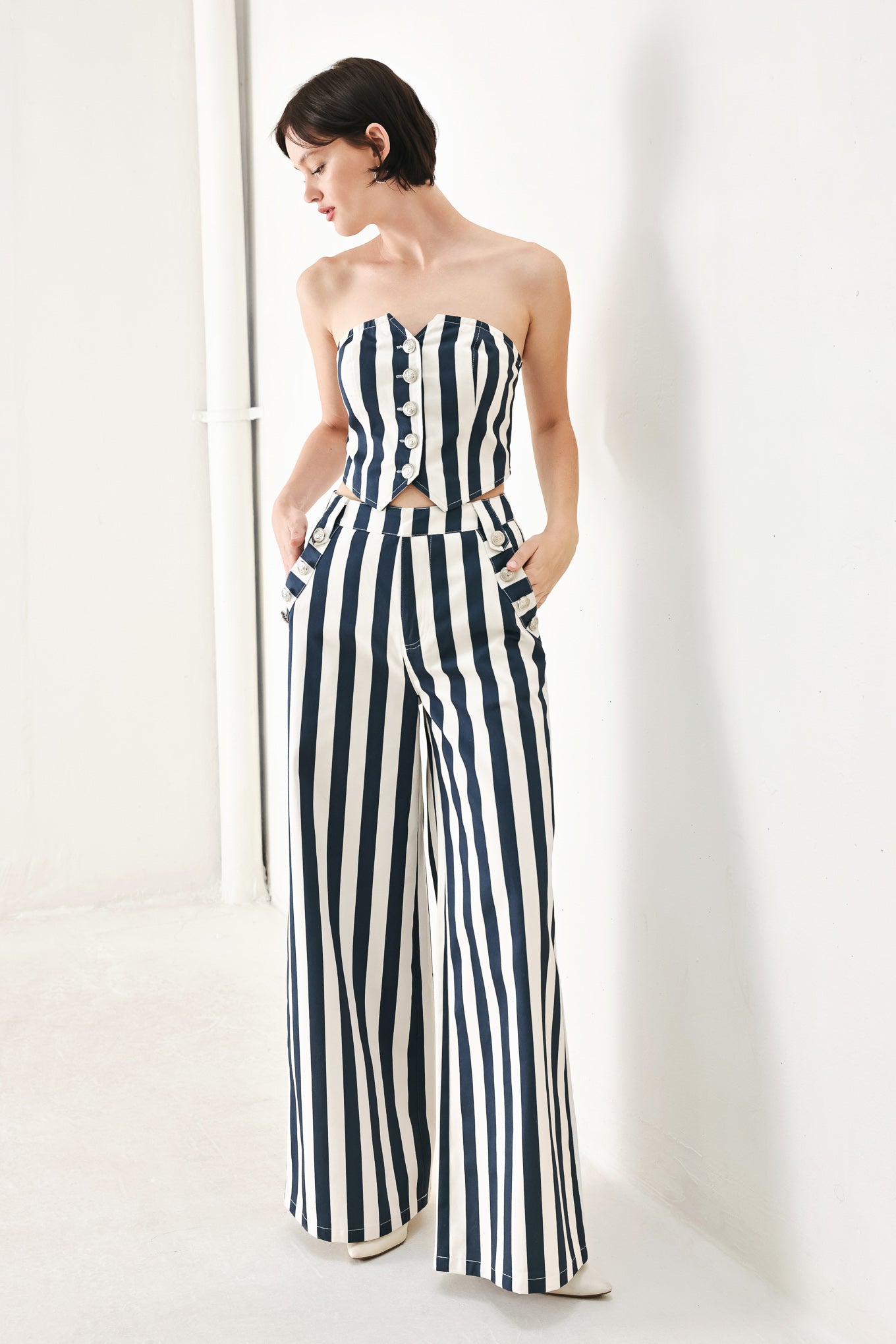 A printed woven tube top with front button down and smocked back