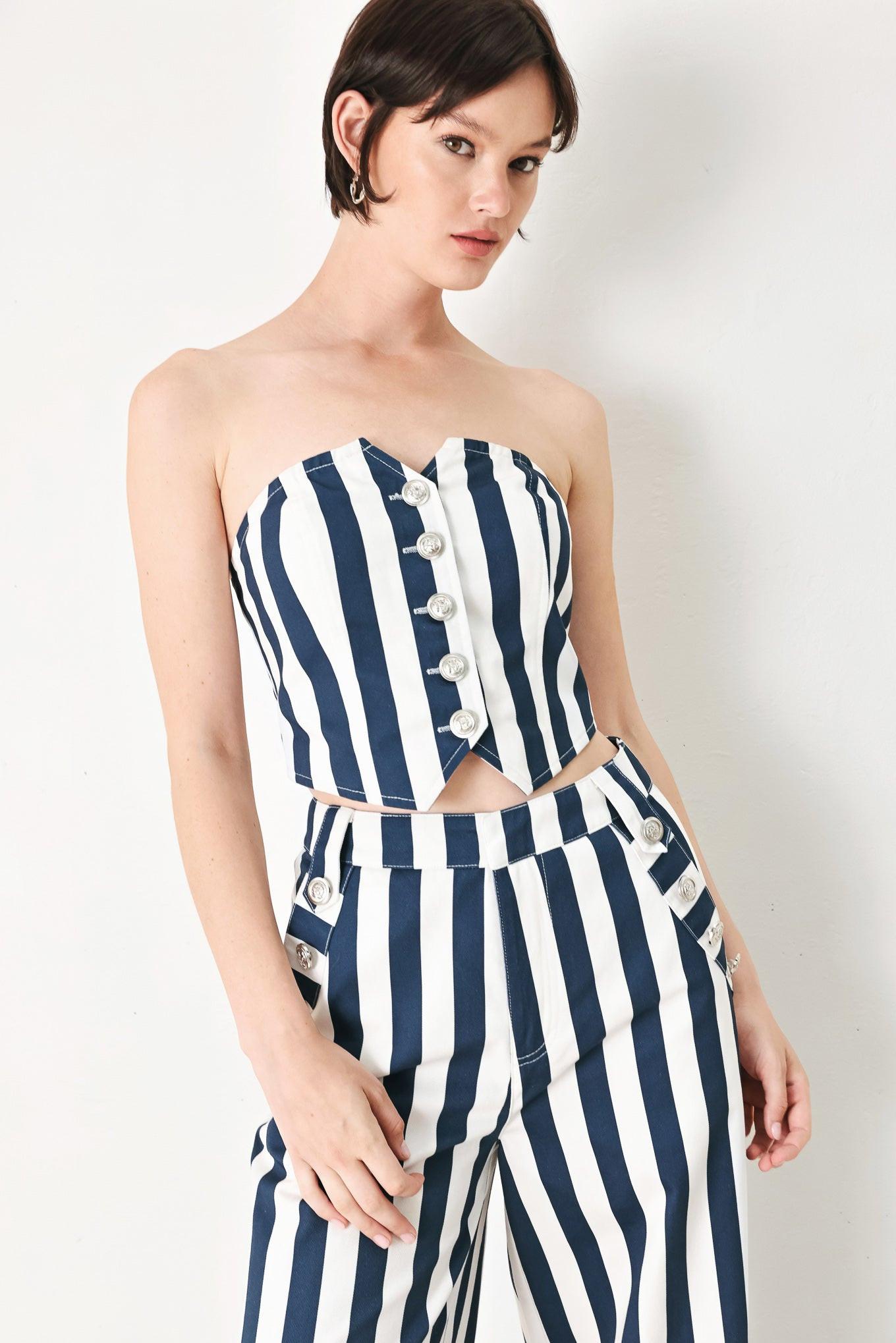 A printed woven tube top with front button down and smocked back