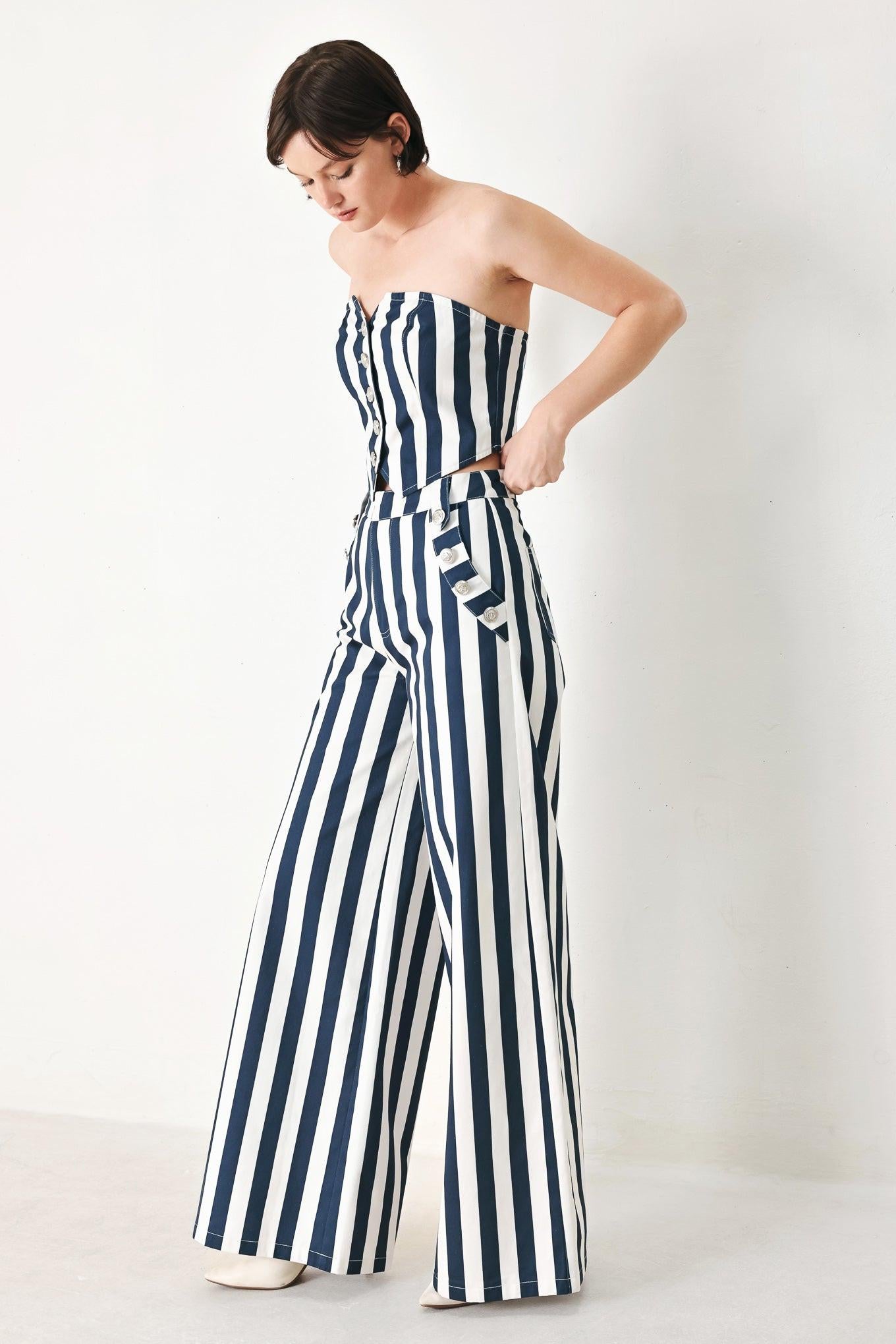 A printed woven tube top with front button down and smocked back