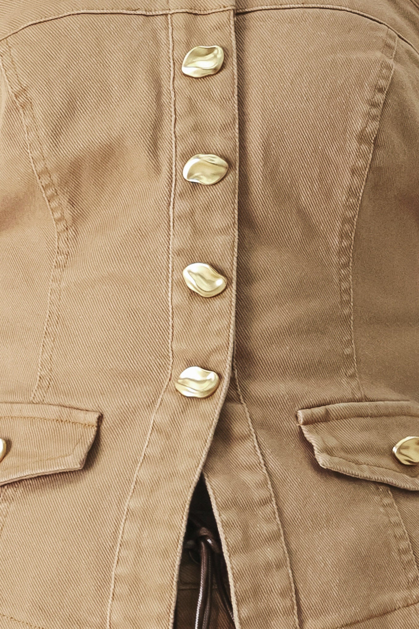 Woman wearing a khaki strapless tube top with front button detail and back zipper closure | FREEMARKET