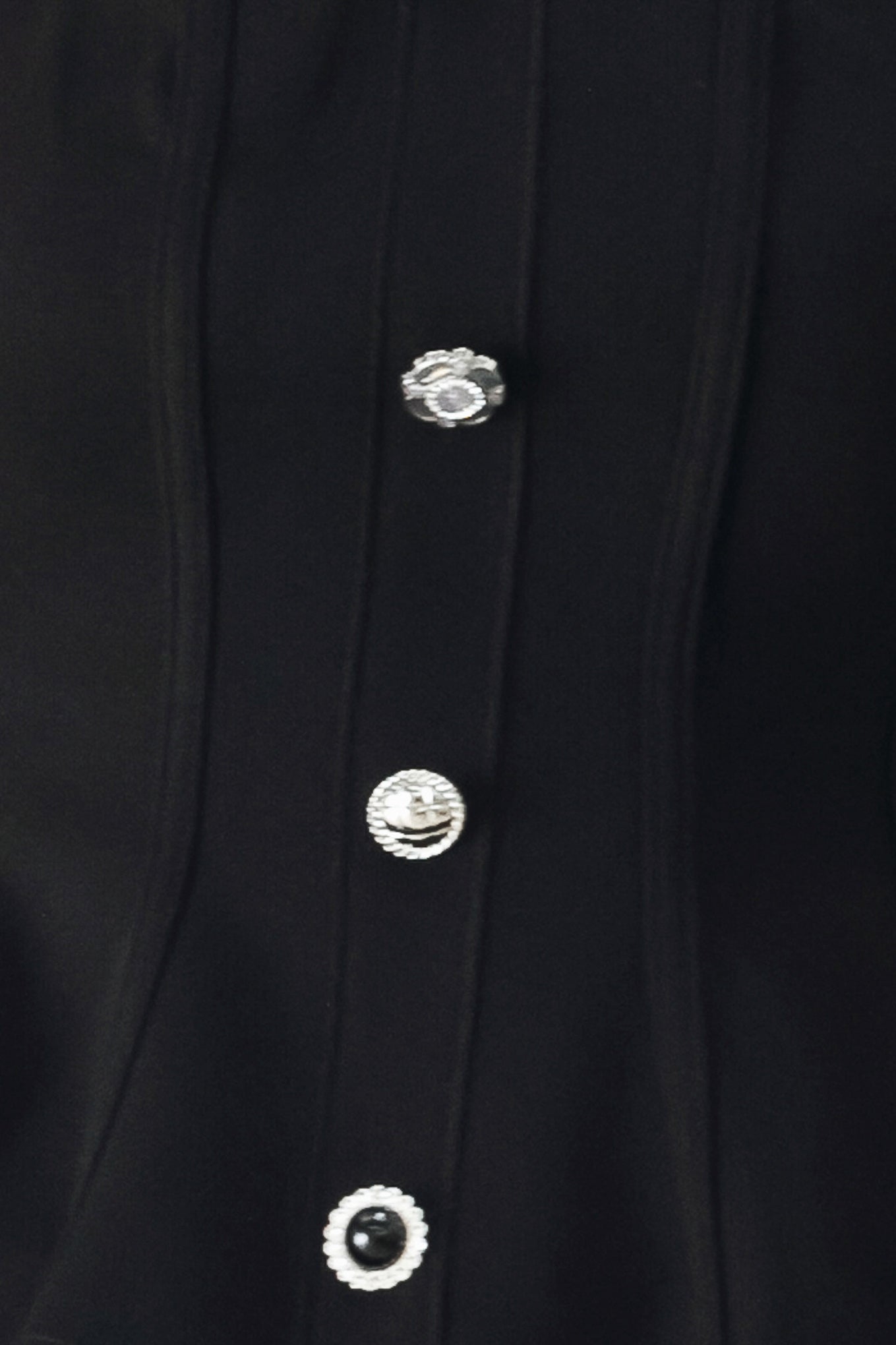 Woman wearing a black strapless tube top with buttons down the front | FREEMARKET