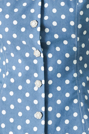 Close up of a blue polka dot top featuring sweetheart neckline, sleeveless, front button detail, peplum and back zipper closure | FREEMARKET