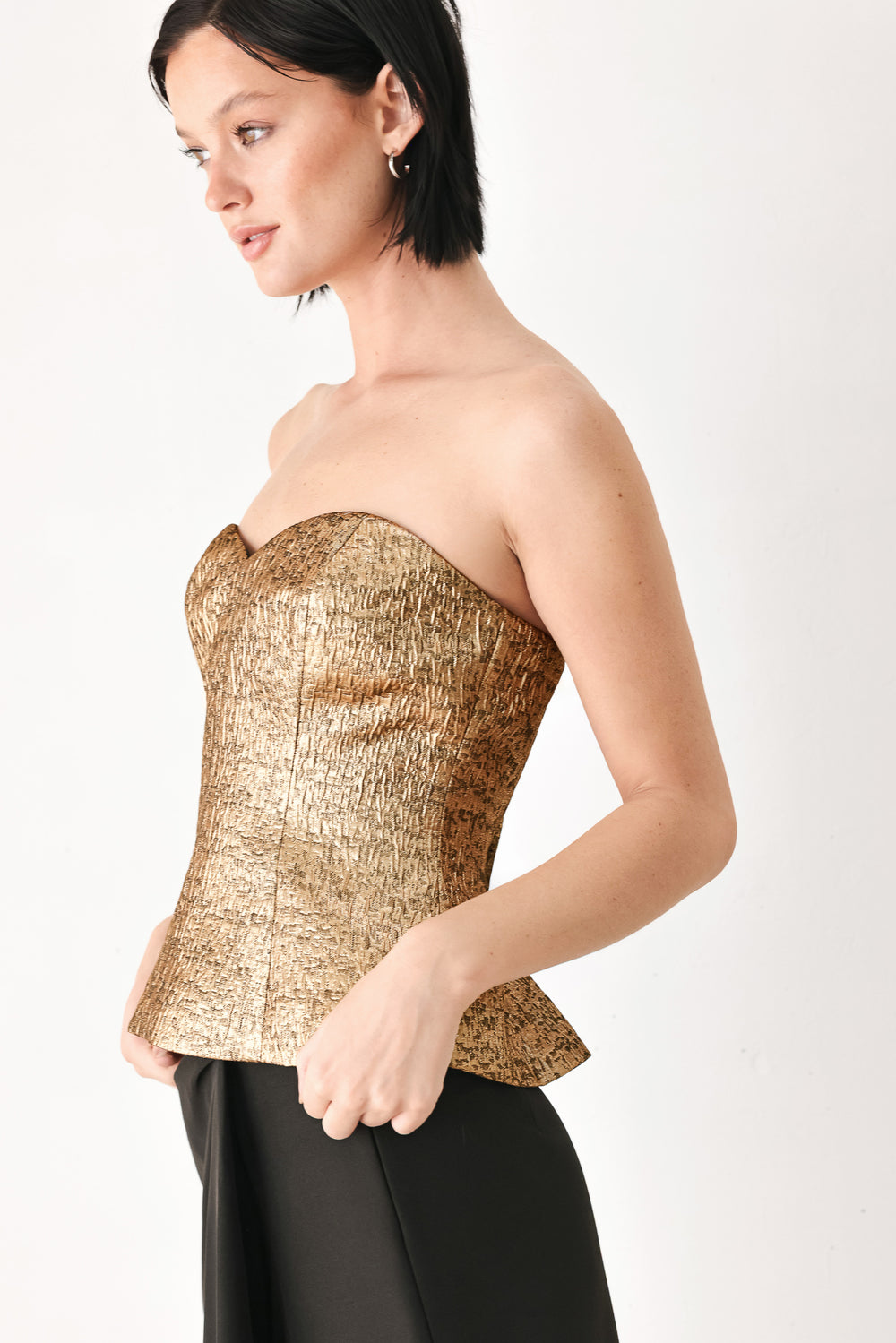 A woman wearing a strapless tube top with sweetheart neckline and back zipper | FREEMARKET