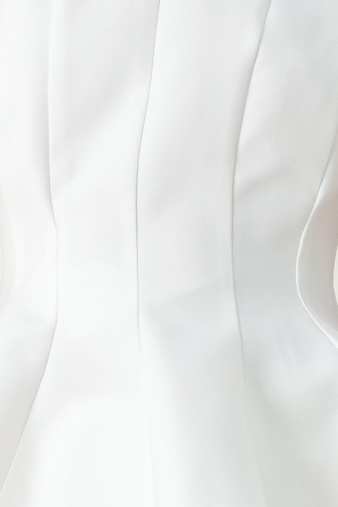 Woman wearing a white peplum top featuring halter neckline and back zipper closure | FREEMARKET