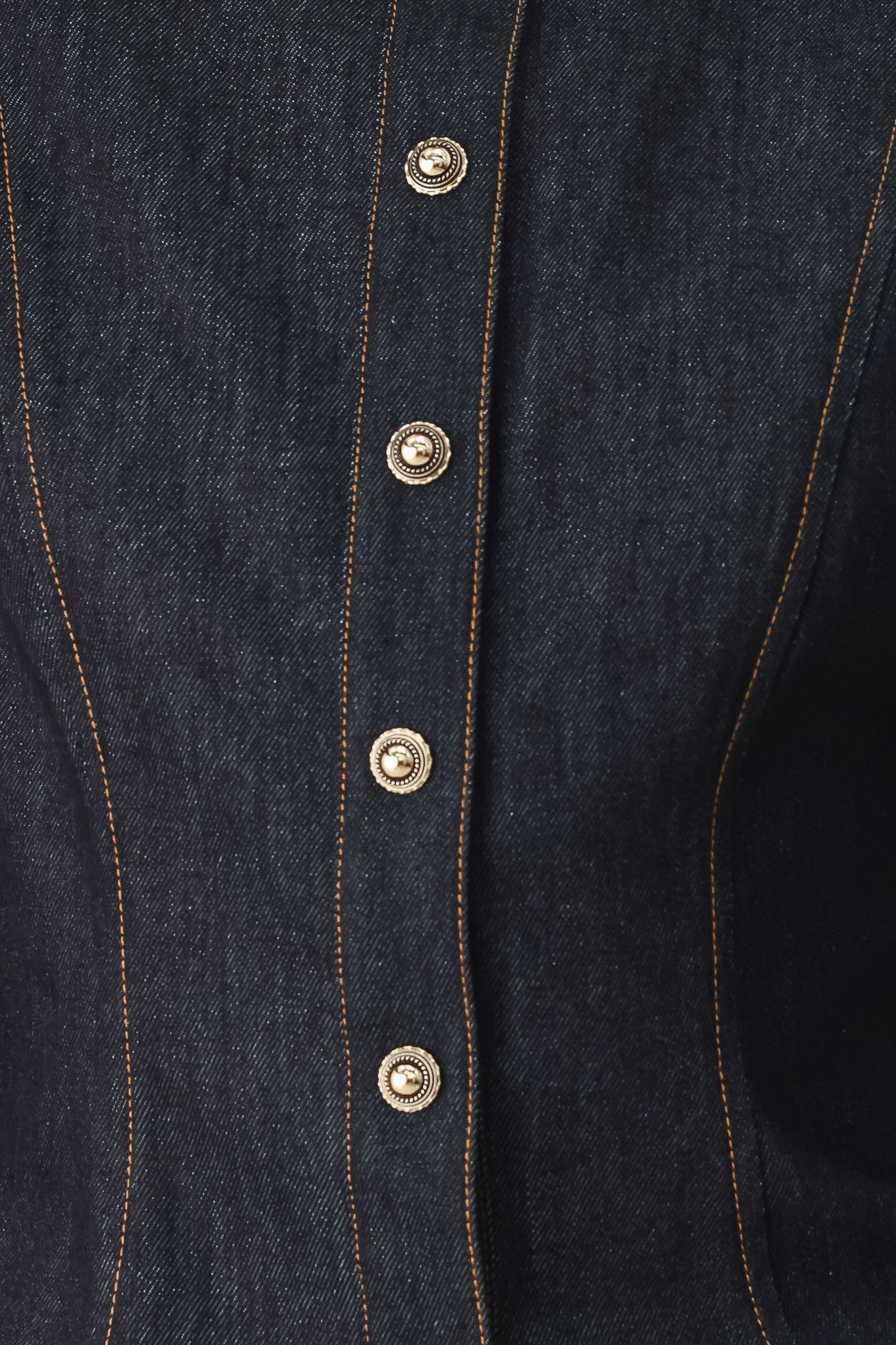 Woman wearing lightweight dark denim top with high neckline, long sleeve, front button down and peplum | FREEMARKET
