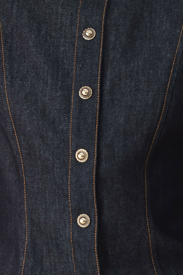 Woman wearing lightweight dark denim top with high neckline, long sleeve, front button down and peplum | FREEMARKET