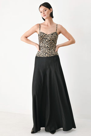 A woman modeling a leopard-print camisole top with thin straps and a structured corset-style bodice | FREEMARKET