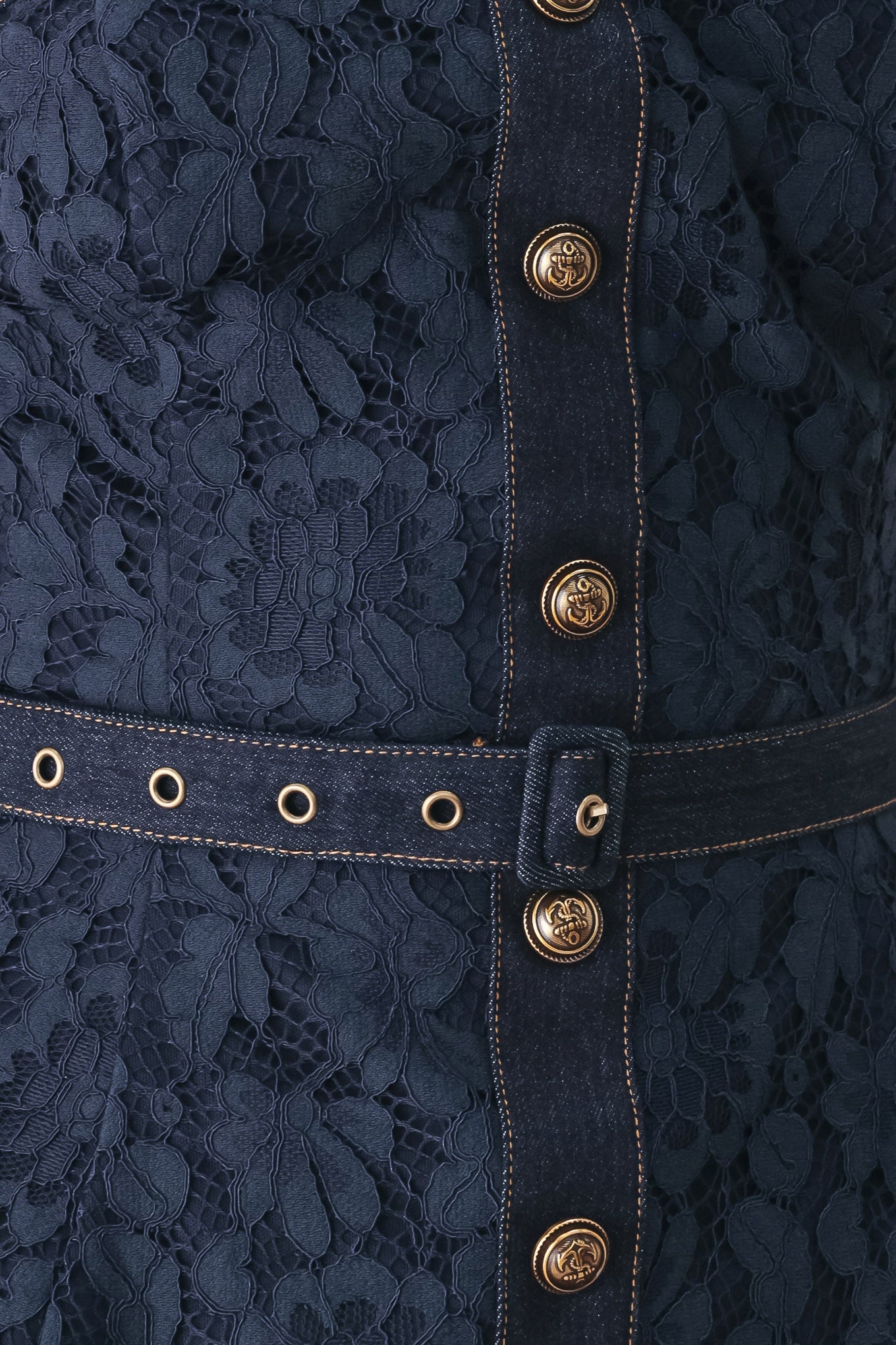 A woman wearing a strapless dark navy blue textured dress with a buttoned waist and a matching belt | FREEMARKET