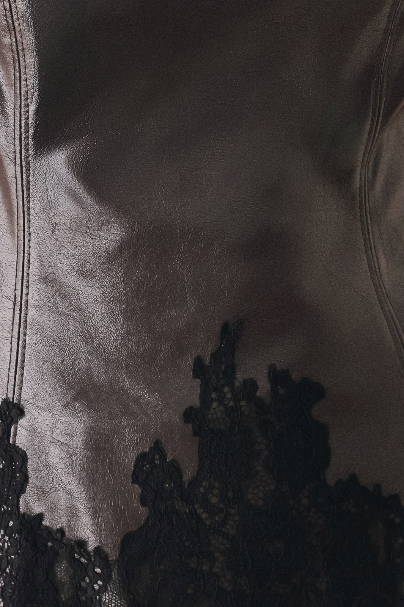A model wearing a dark brown faux-leather corset top with a sweetheart neckline and black lace trim at the waist | FREEMARKET