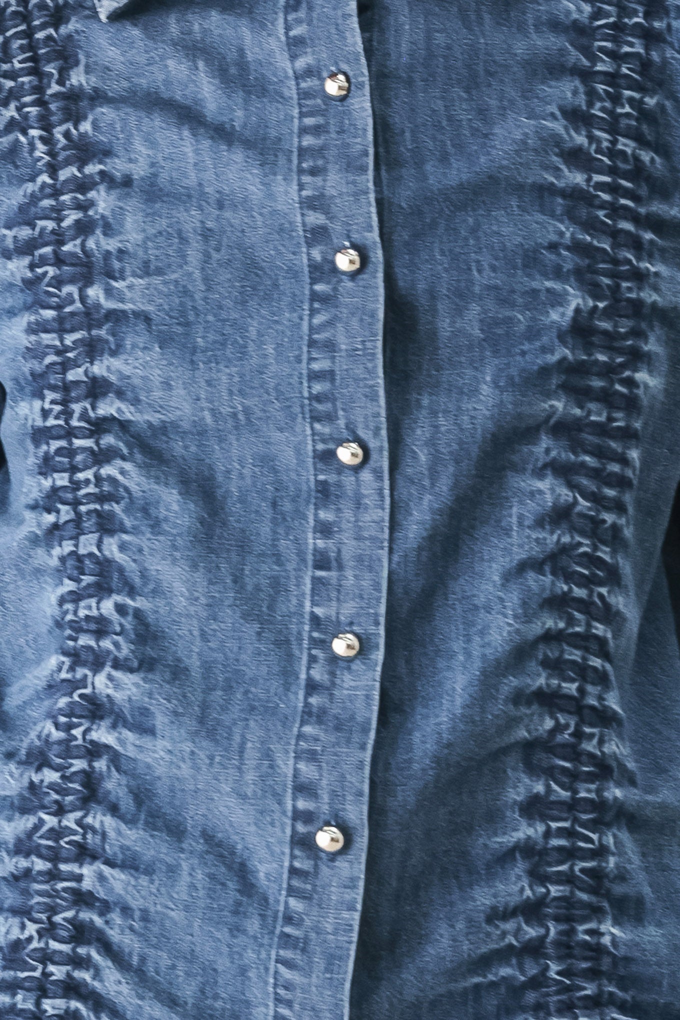 A model wearing a blue denim long-sleeve button-up shirt with ruched detailing | FREEMARKET