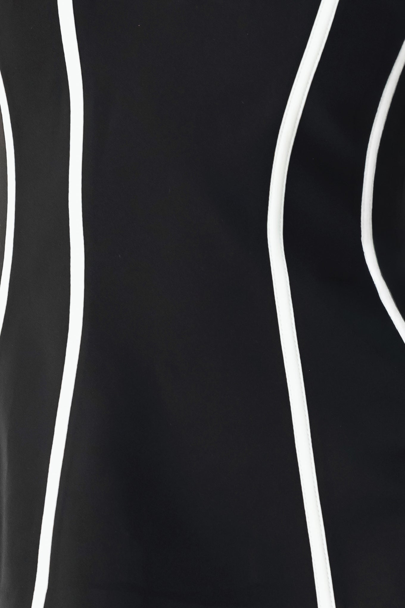 A woman wearing a strapless black corset-style top with bold white vertical stripes | FREEMARKET