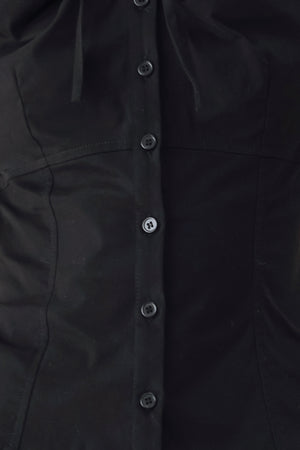A woman wearing a black short-sleeve blouse with puff sleeves, a ruffled collar, and a keyhole cutout at the neckline | FREEMARKET