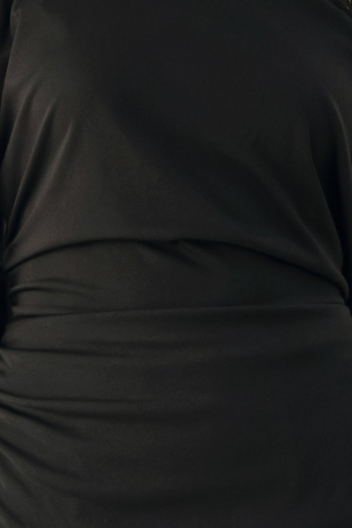 A model wearing a black asymmetrical off-the-shoulder top with black lace trim along the neckline, cuffs, and hem | FREEMARKET