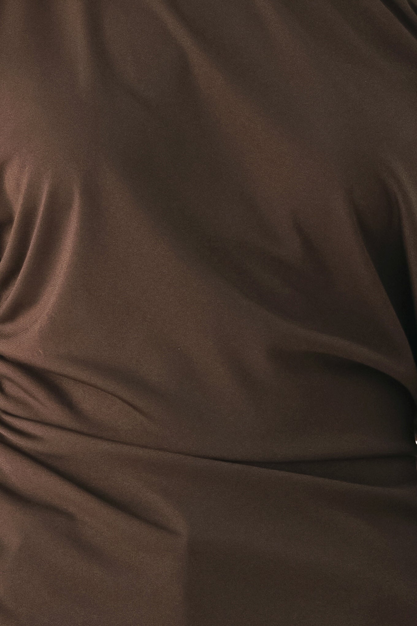 A model wearing a dark brown asymmetrical off-the-shoulder top with brown lace trim along the neckline, cuffs, and hem | FREEMARKET