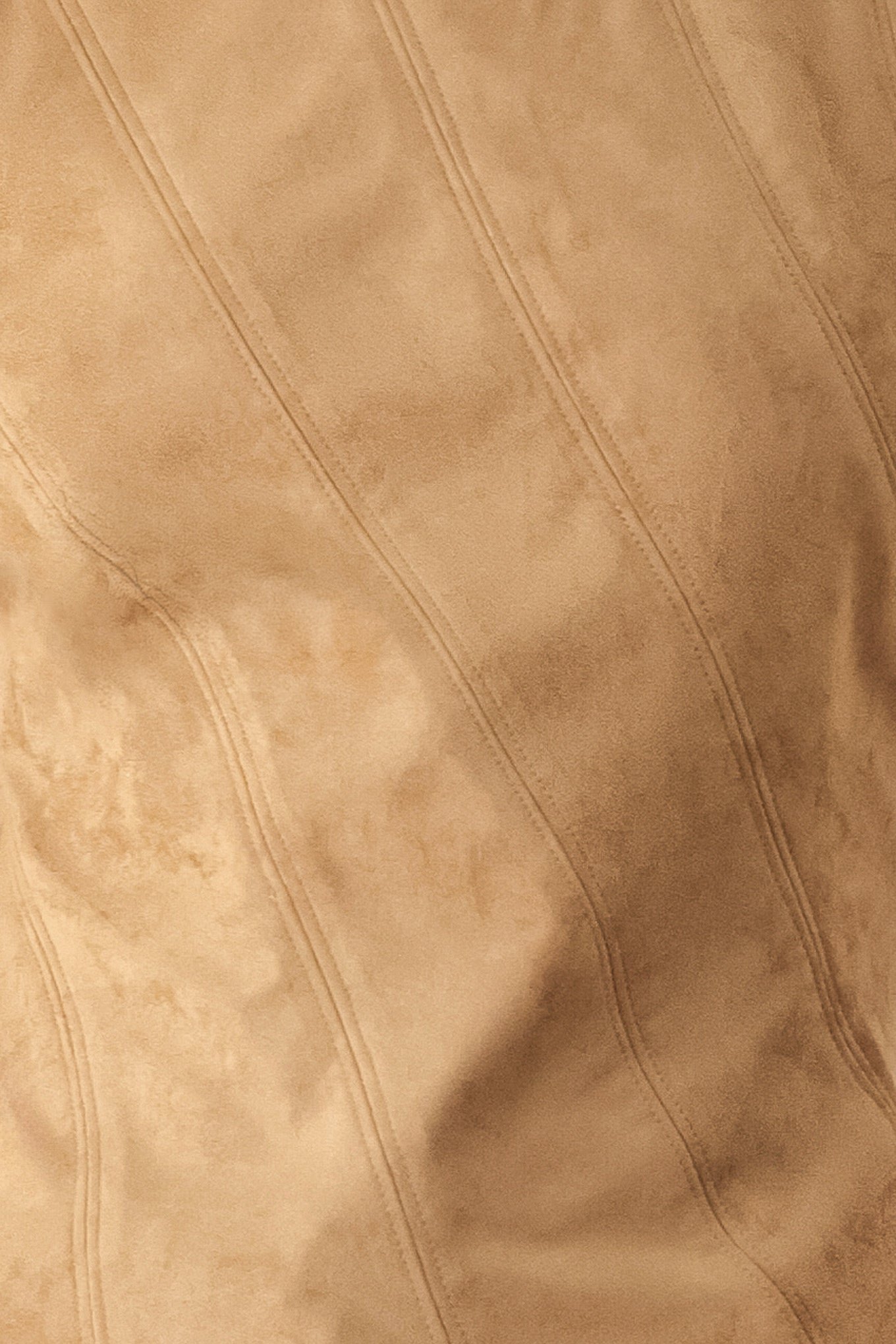 A woman wearing a faux suede camel  top width diagonal stitches and back zipper | FREEMARKET