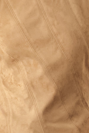 A woman wearing a faux suede camel  top width diagonal stitches and back zipper | FREEMARKET