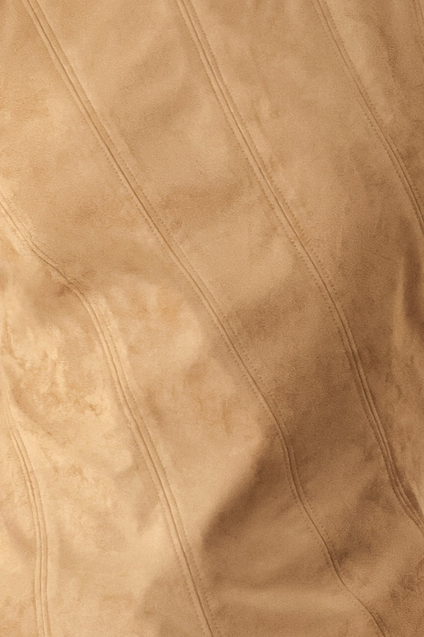 A woman wearing a faux suede camel  top width diagonal stitches and back zipper | FREEMARKET