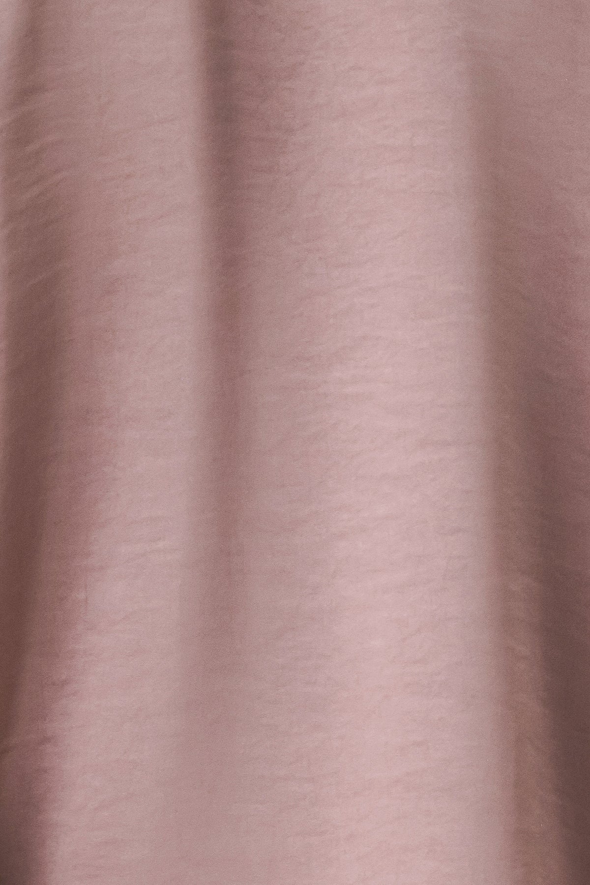 A woman wearing a dusty mauve long-sleeve silk blouse with a shawl collar and front tie | FREEMARKET