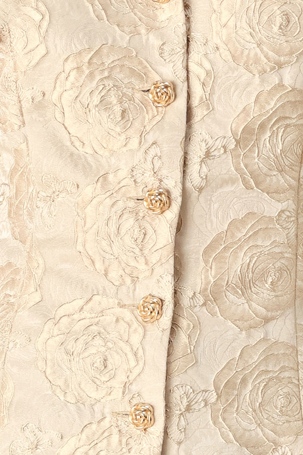 A woman wearing a beige gold jacquard corset-style blouse with puff sleeves and a sweetheart neckline | FREEMARKET